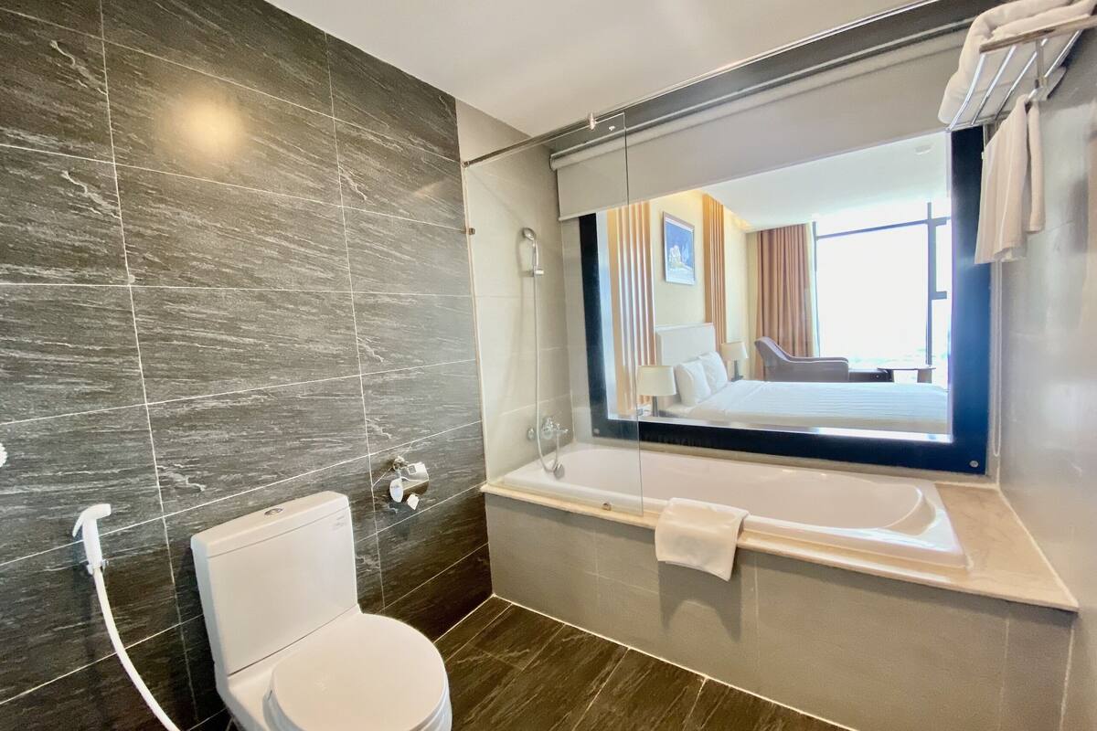 deluxe king room | bathroom | free toiletries, hair dryer, bathrobes, slippers