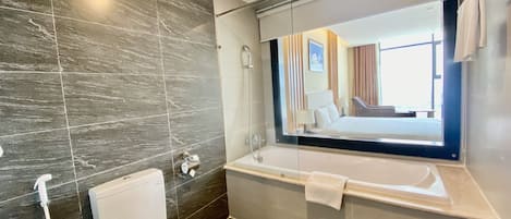 Deluxe King Room | Bathroom | Free toiletries, hair dryer, bathrobes, slippers