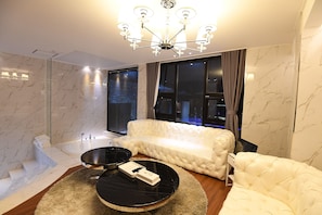 Presidential Suite | Living area | 45-inch flat-screen TV with cable channels, TV, pay films