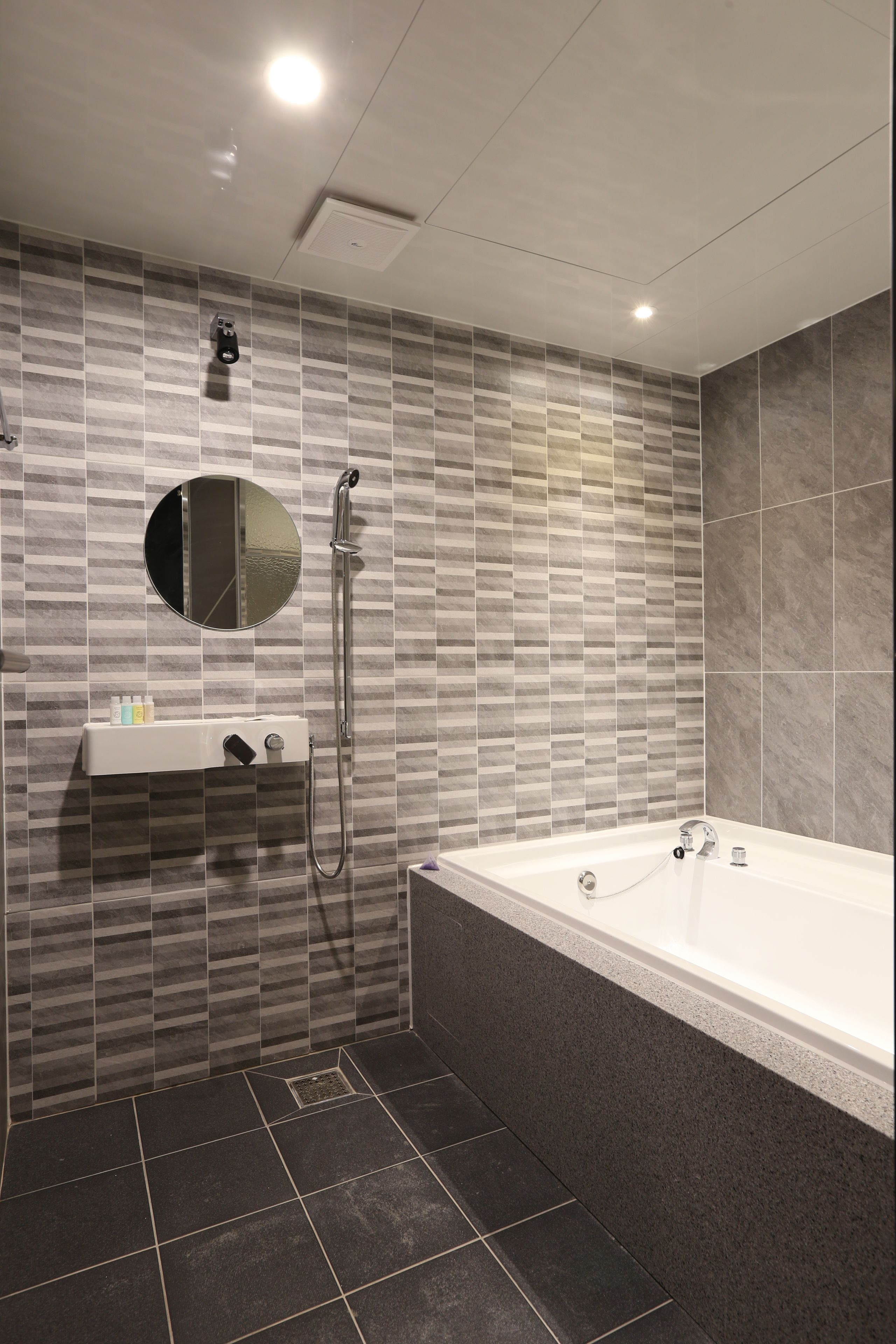 separate bathtub and shower, hair dryer, bathrobes, slippers