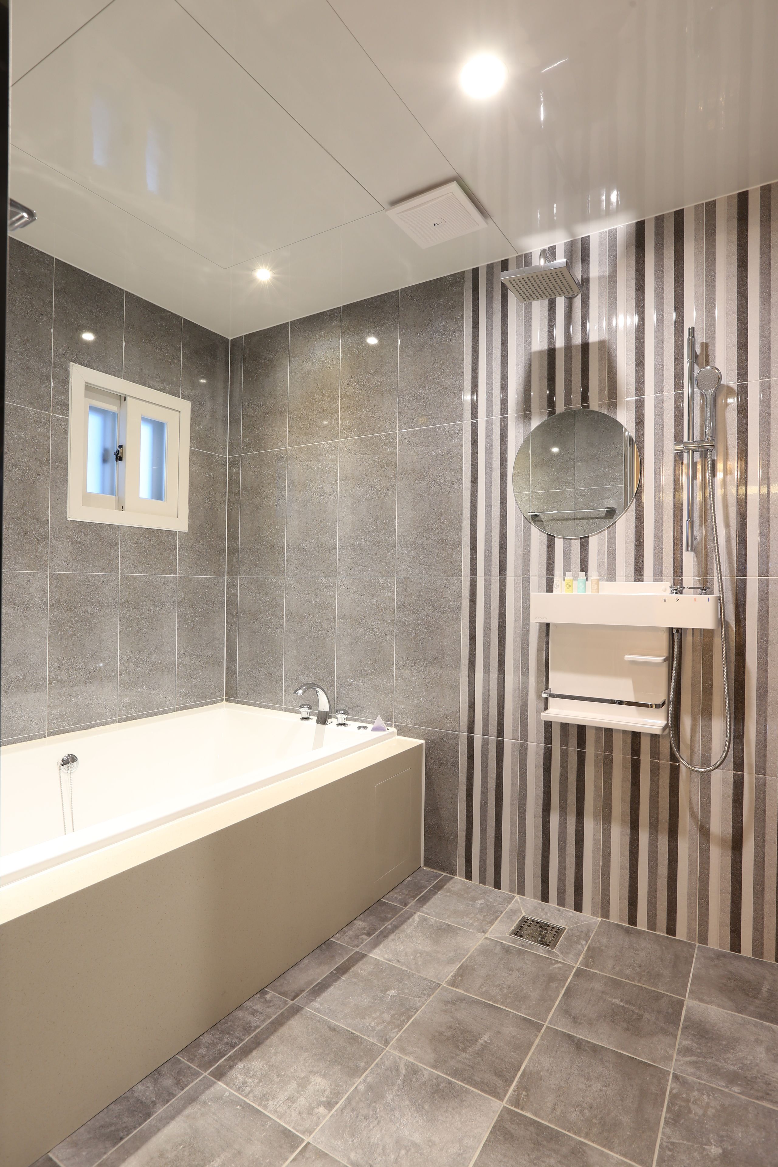 separate bathtub and shower, hair dryer, bathrobes, slippers