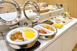 A buffet with various food items and a self-service beverage dispenser. - Smile Hotel Hakata Ekimae (Fukuoka)