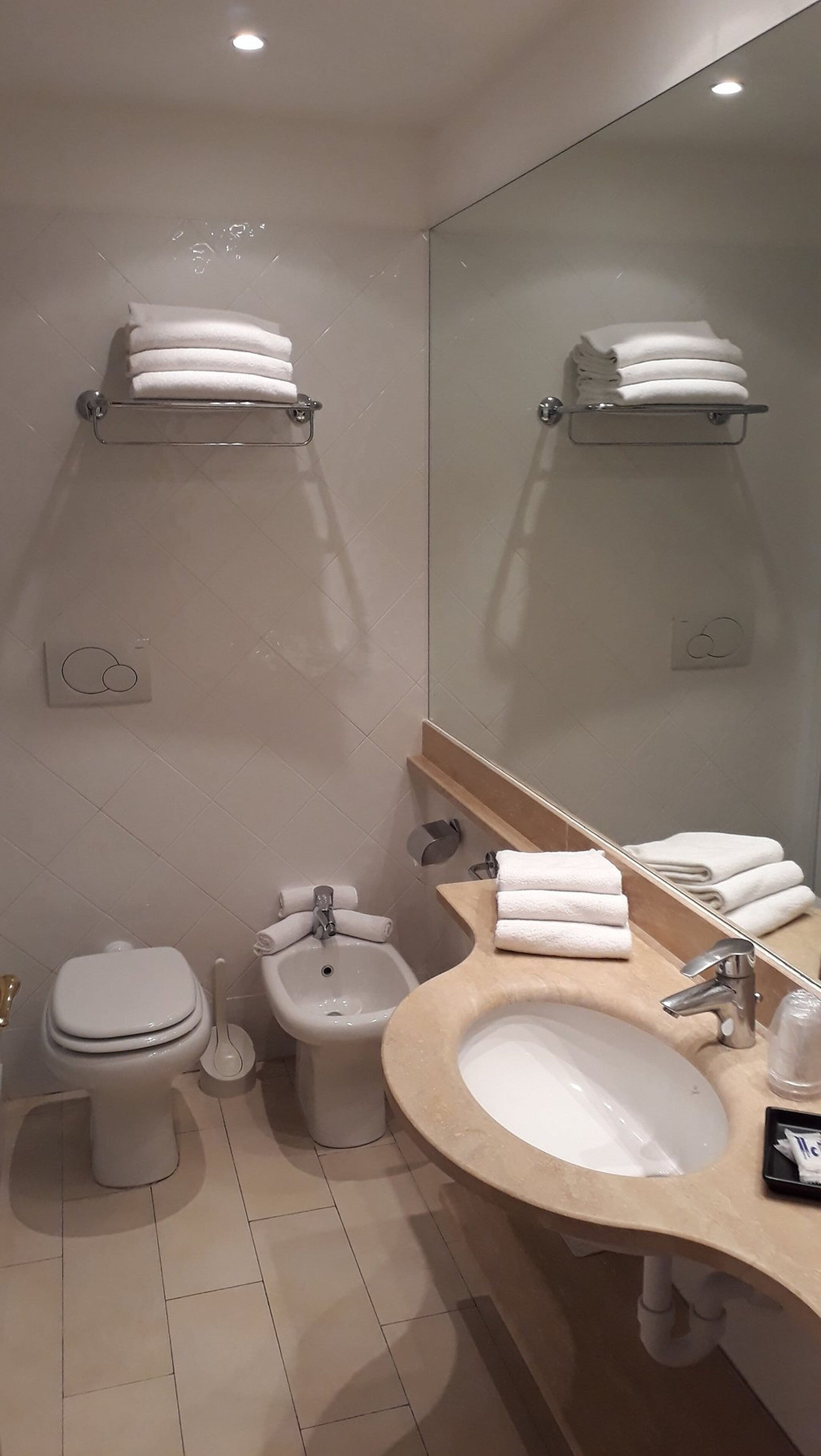 free toiletries, hair dryer, bidet, towels