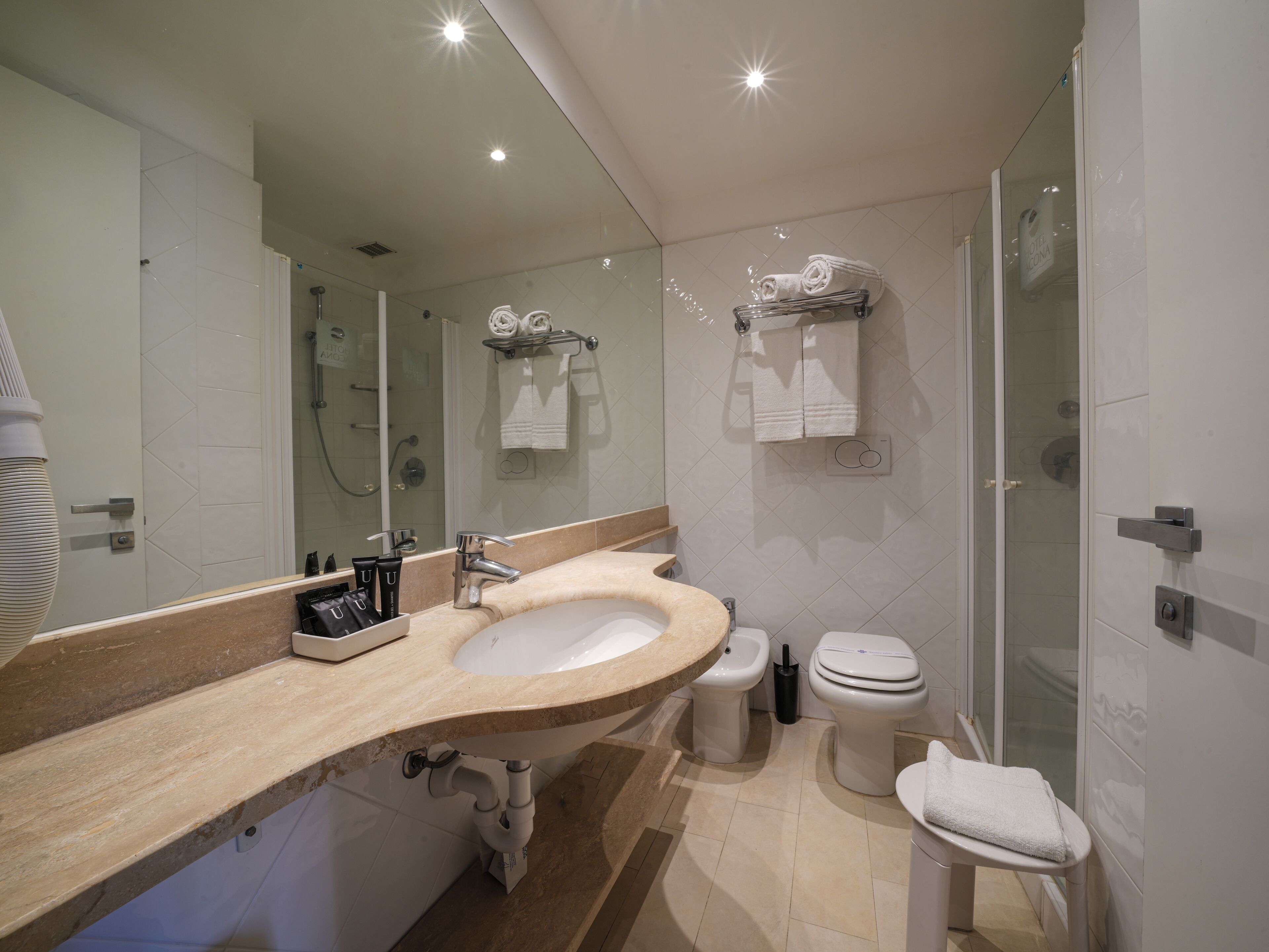 free toiletries, hair dryer, bidet, towels