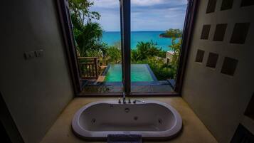 Deluxe Pool Villa Ocean View | Bathroom | Separate tub and shower, rainfall showerhead, free toiletries