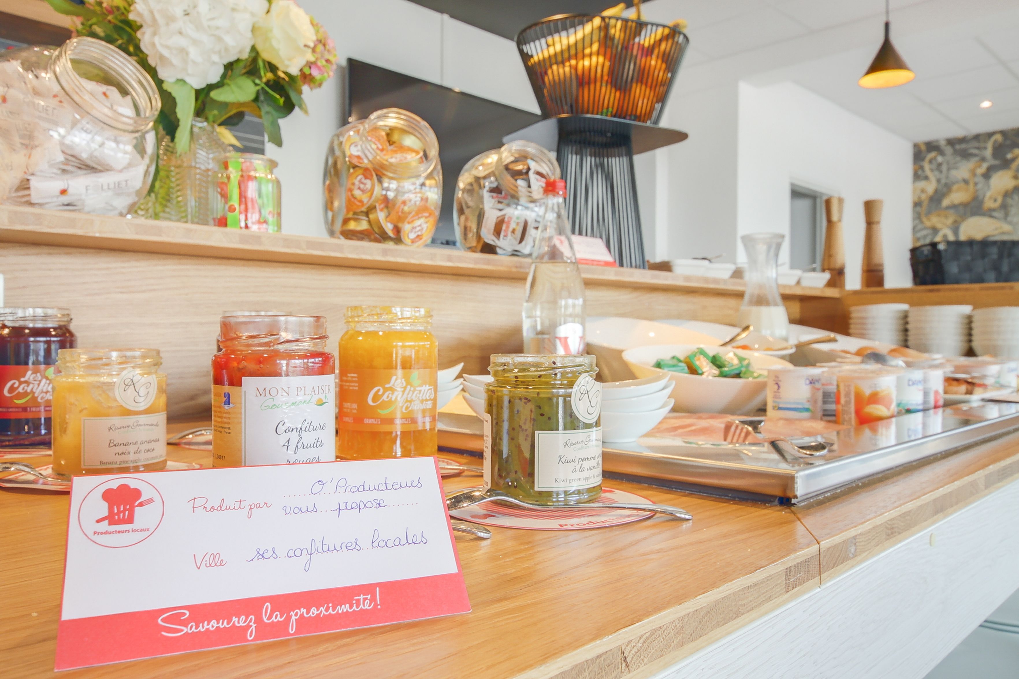 A breakfast buffet with various food items and condiments.