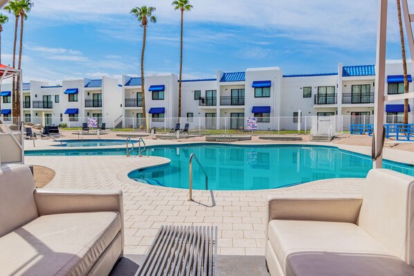 Seasonal outdoor pool, open 9:00 AM to 9:00 PM, pool umbrellas