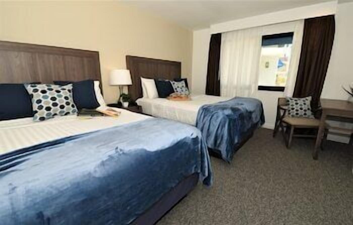 Pillowtop beds, desk, laptop workspace, free WiFi