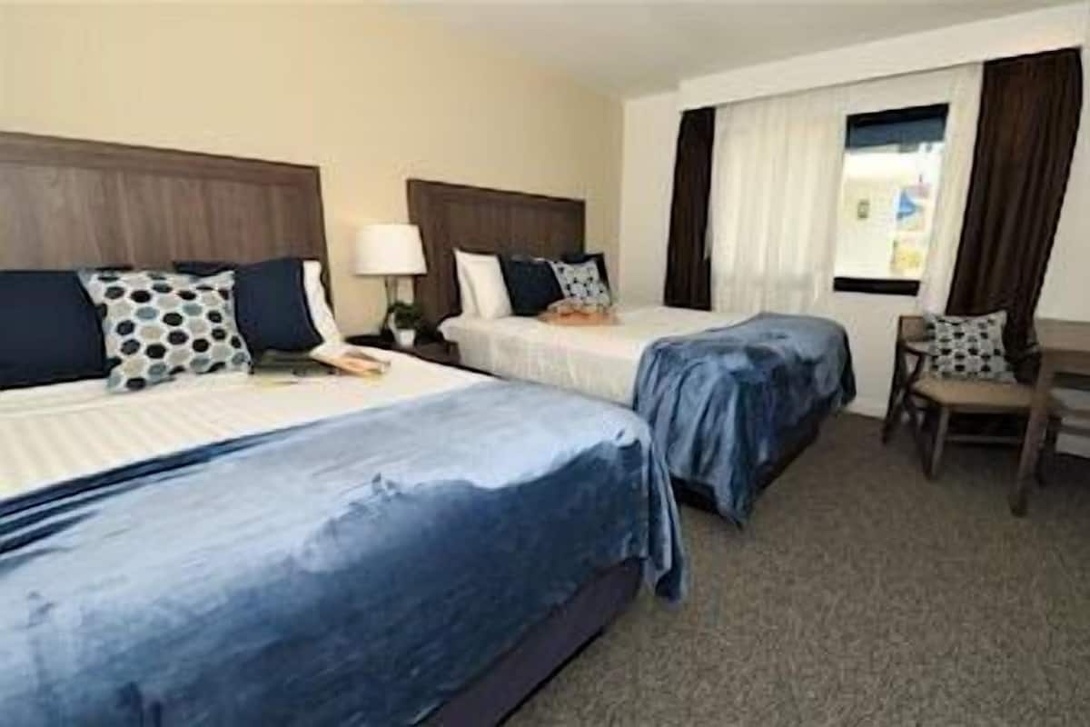 Pillowtop beds, desk, laptop workspace, free WiFi