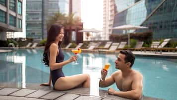 Outdoor pool, pool umbrellas, sun loungers