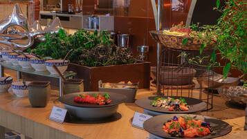 A buffet area with various dishes, including Nizza, Mackerel, and Smoked Salmon.