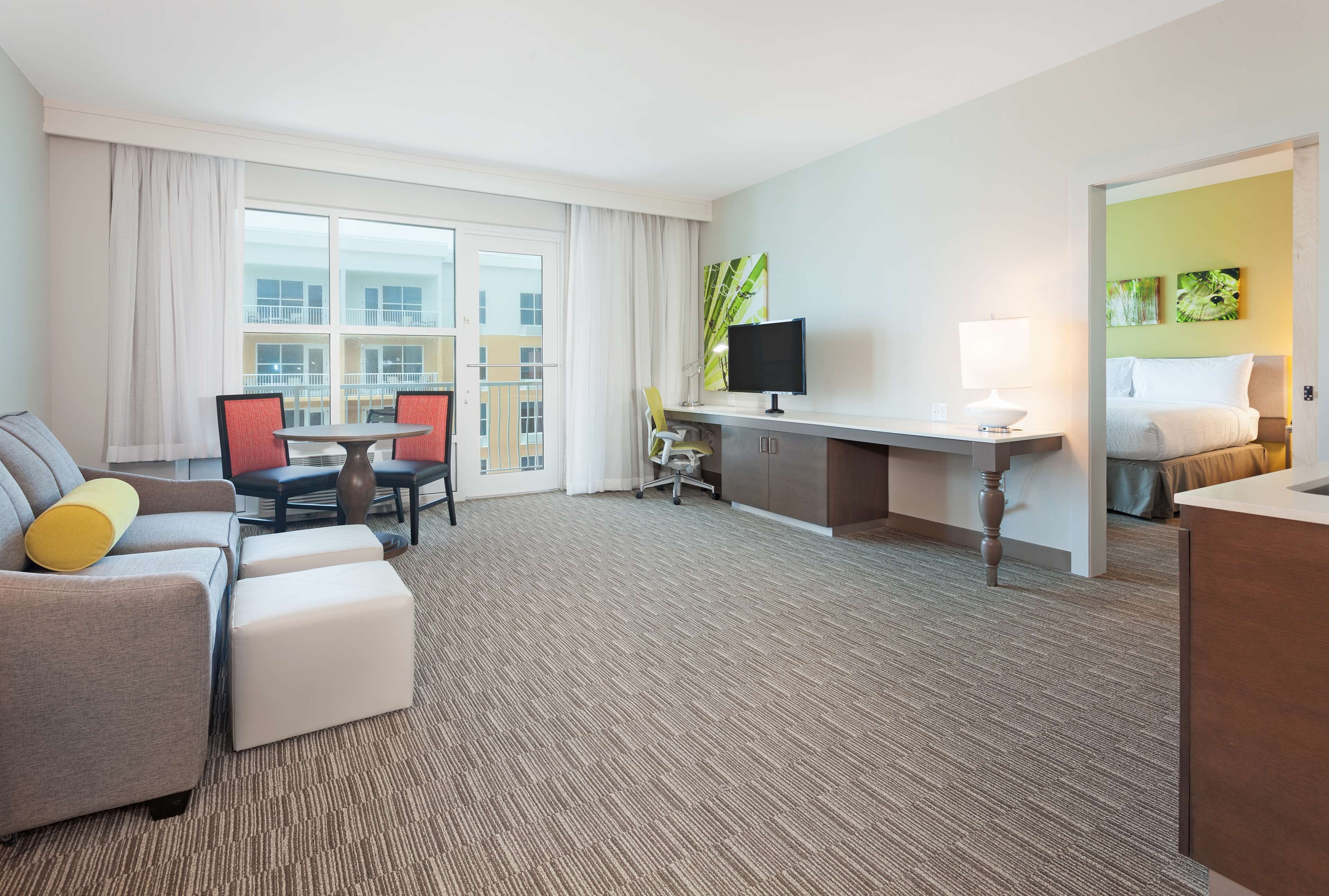 suite, 1 king bed, pool/gulf view | living area | lcd tv