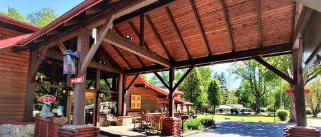 A covered wooden building with a sign indicating a lobby.