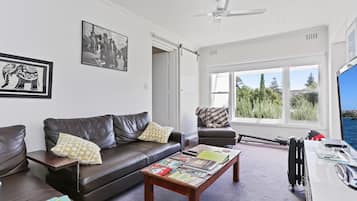 Family Suite (King + Queen) | Living area | LED TV, Netflix, DVD player
