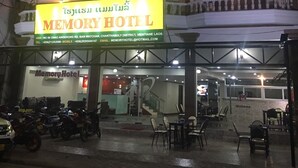 The exterior of the Memory Hotel with a prominent sign, a balcony, and a reception area visible. - Memory Hotel (Vientiane)