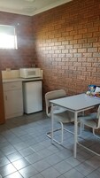 Disabled Room | Private kitchenette | Fridge, microwave, coffee/tea maker, electric kettle