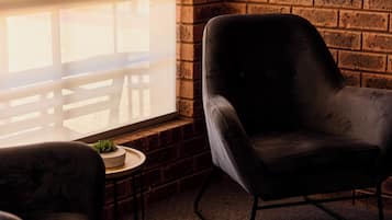 Deluxe Room, 1 King Bed | Living area | Flat-screen TV