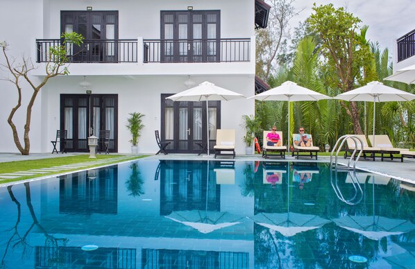 Outdoor pool, pool umbrellas, pool loungers