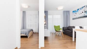 Apartment, 1 Bedroom | Living area | Flat-screen TV