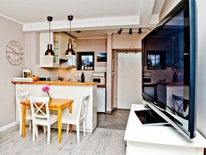 Apartment, 1 Bedroom (ul. Miedzymorze 10/28) | Living area | Flat-screen TV