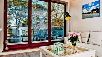 Apartment, 1 Bedroom (ul. Miedzymorze 10/28) | Living room | Flat-screen TV