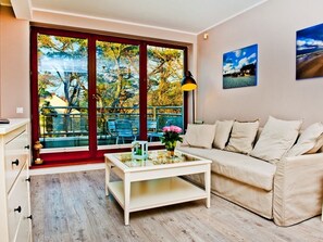 Apartment, 1 Bedroom (ul. Miedzymorze 10/28) | Living room | Flat-screen TV