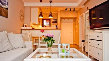 Apartment, 1 Bedroom (ul. Miedzymorze 10/28) | Living area | Flat-screen TV