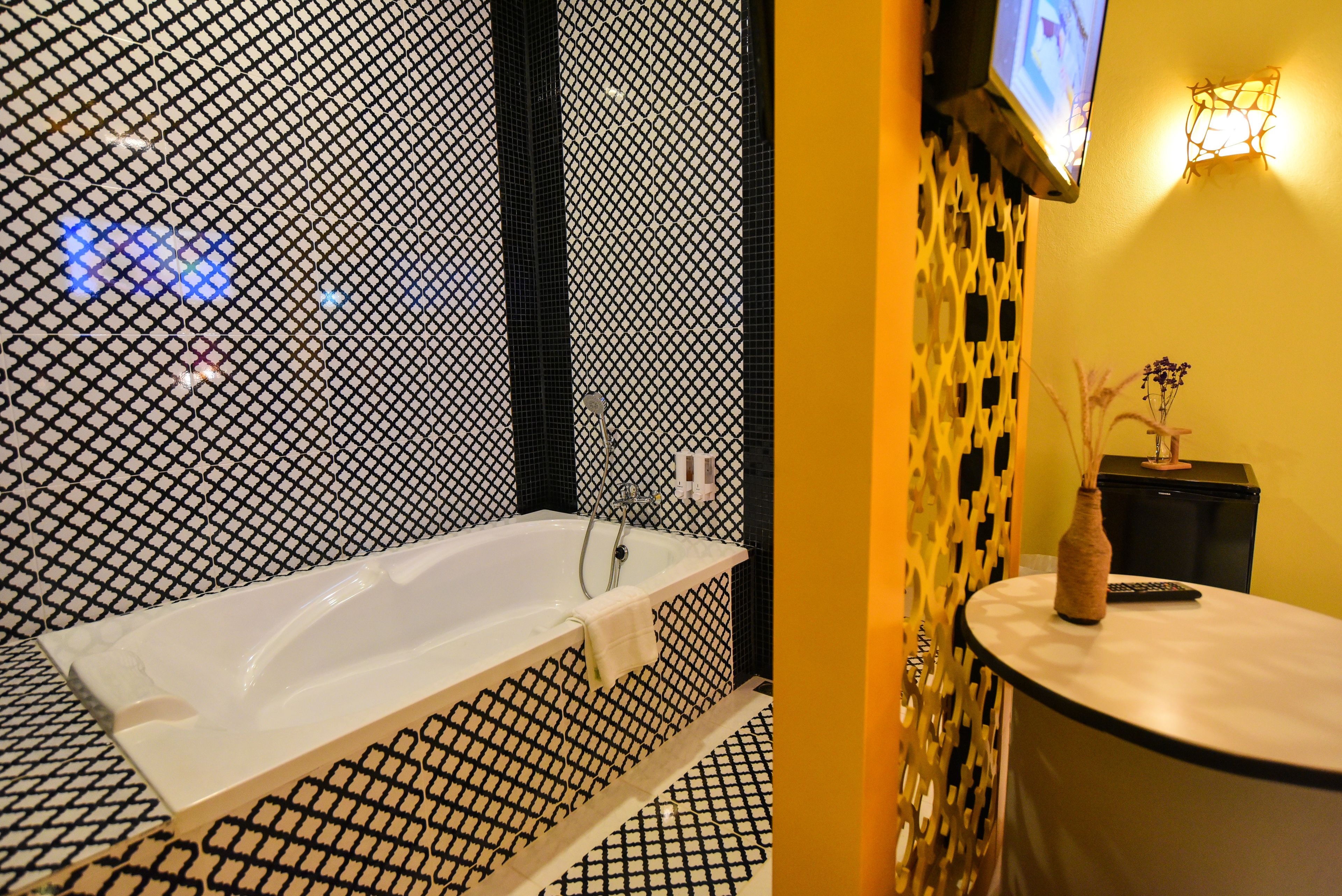 family quadruple room, 2 bedrooms, bathtub | bathroom | separate bathtub and shower, rainfall showerhead, free toiletries