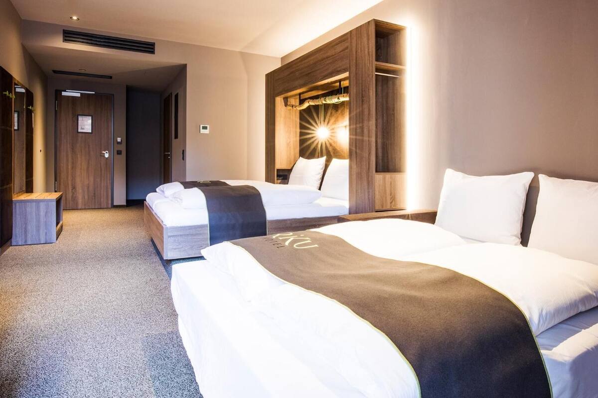 hypo-allergenic bedding, desk, blackout curtains, soundproofing