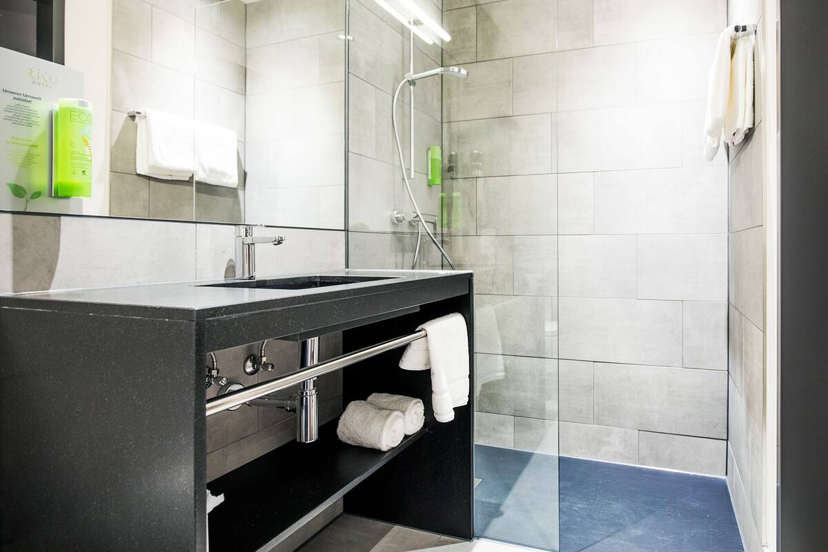 shower, hair dryer, heated floors, towels