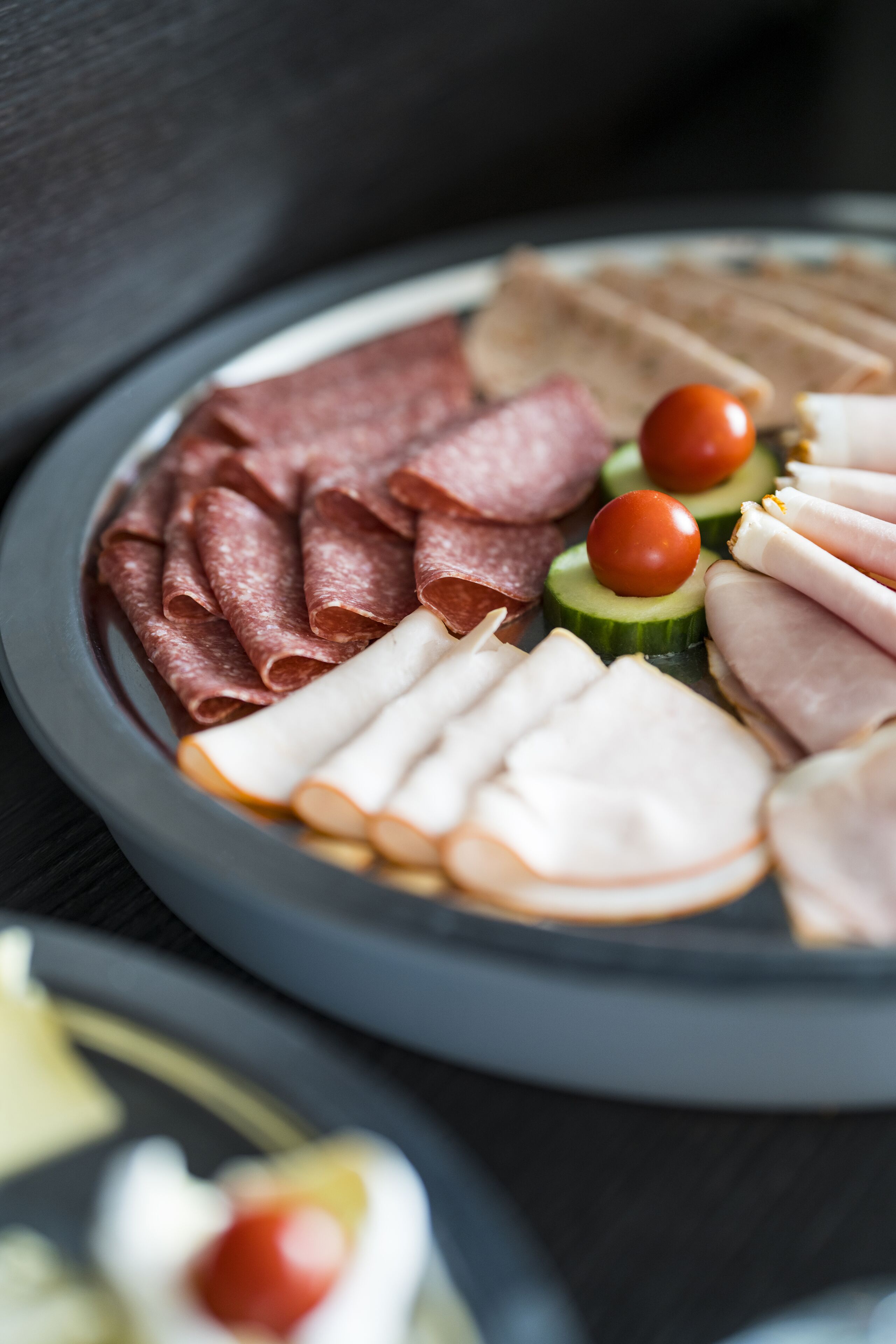 A plate of assorted meats and vegetables.