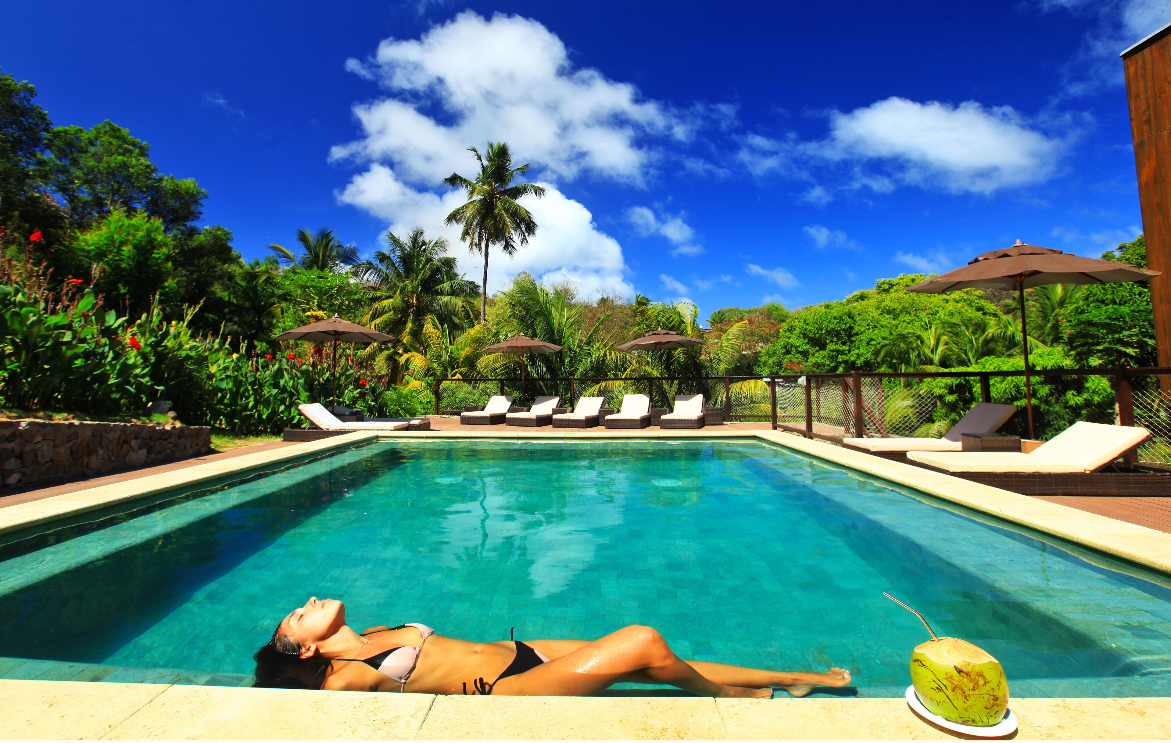 Outdoor pool, open 9:00 AM to 9:00 PM, pool umbrellas, pool loungers