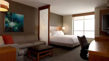 Hypo-allergenic bedding, desk, laptop workspace, blackout curtains