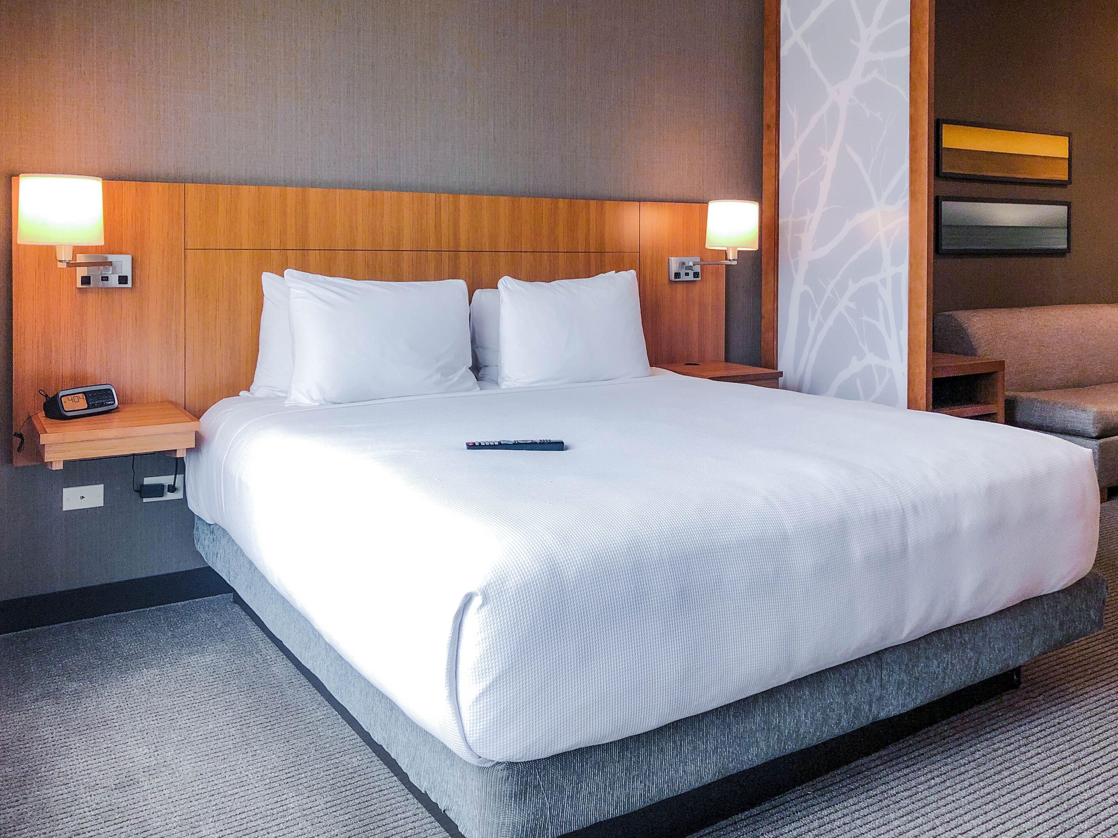 hypo-allergenic bedding, desk, laptop workspace, blackout curtains