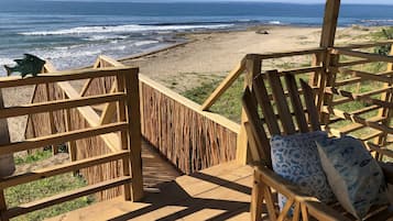 On the beach, sun-loungers, beach towels, beach yoga