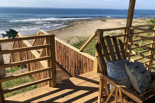 On the beach, sun-loungers, beach towels, beach yoga