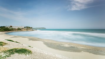 On the beach, sun loungers, beach towels, beach yoga