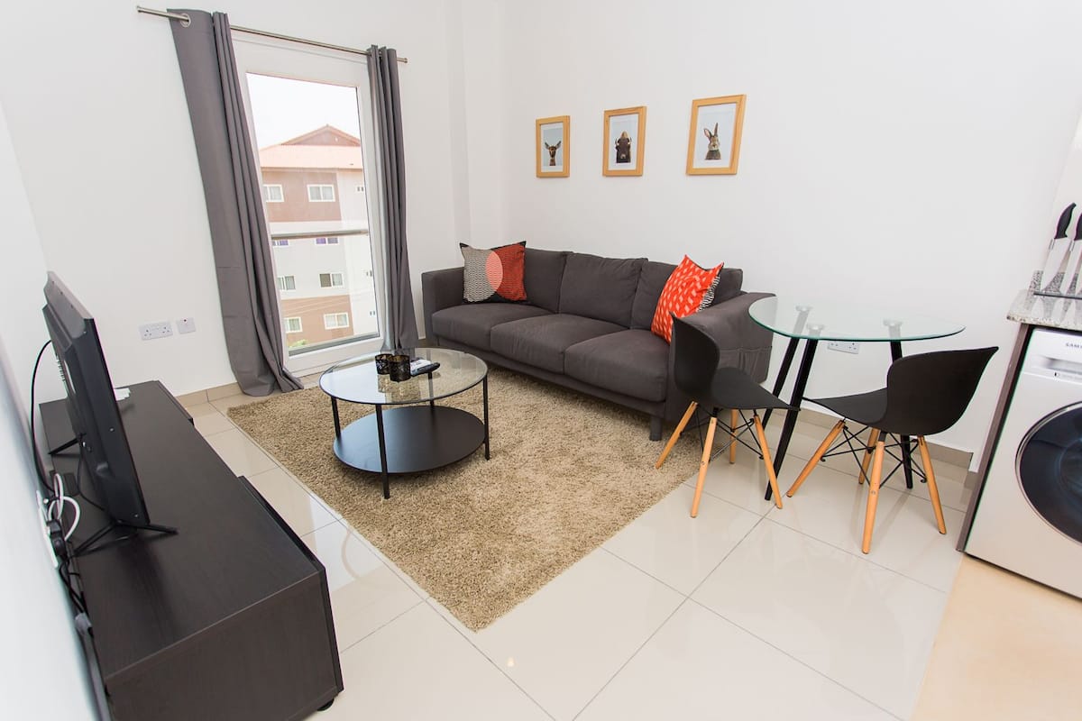 Exclusive Apartment, 1 Bedroom | Living area | 36-inch flat-screen TV with cable channels, TV, pay movies