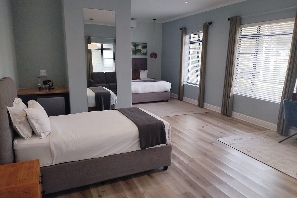 family room | 2 bedrooms, premium bedding, in-room safe, desk