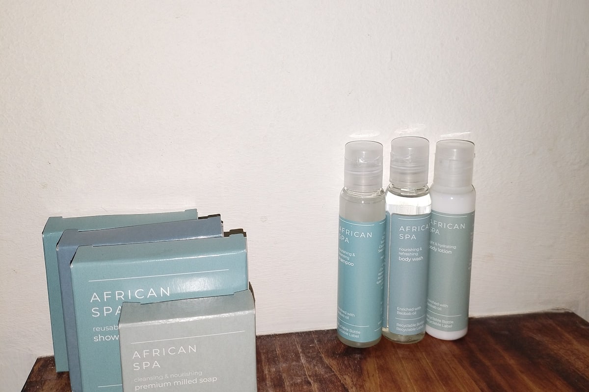 superior suite | bathroom | shower, free toiletries, hair dryer, towels