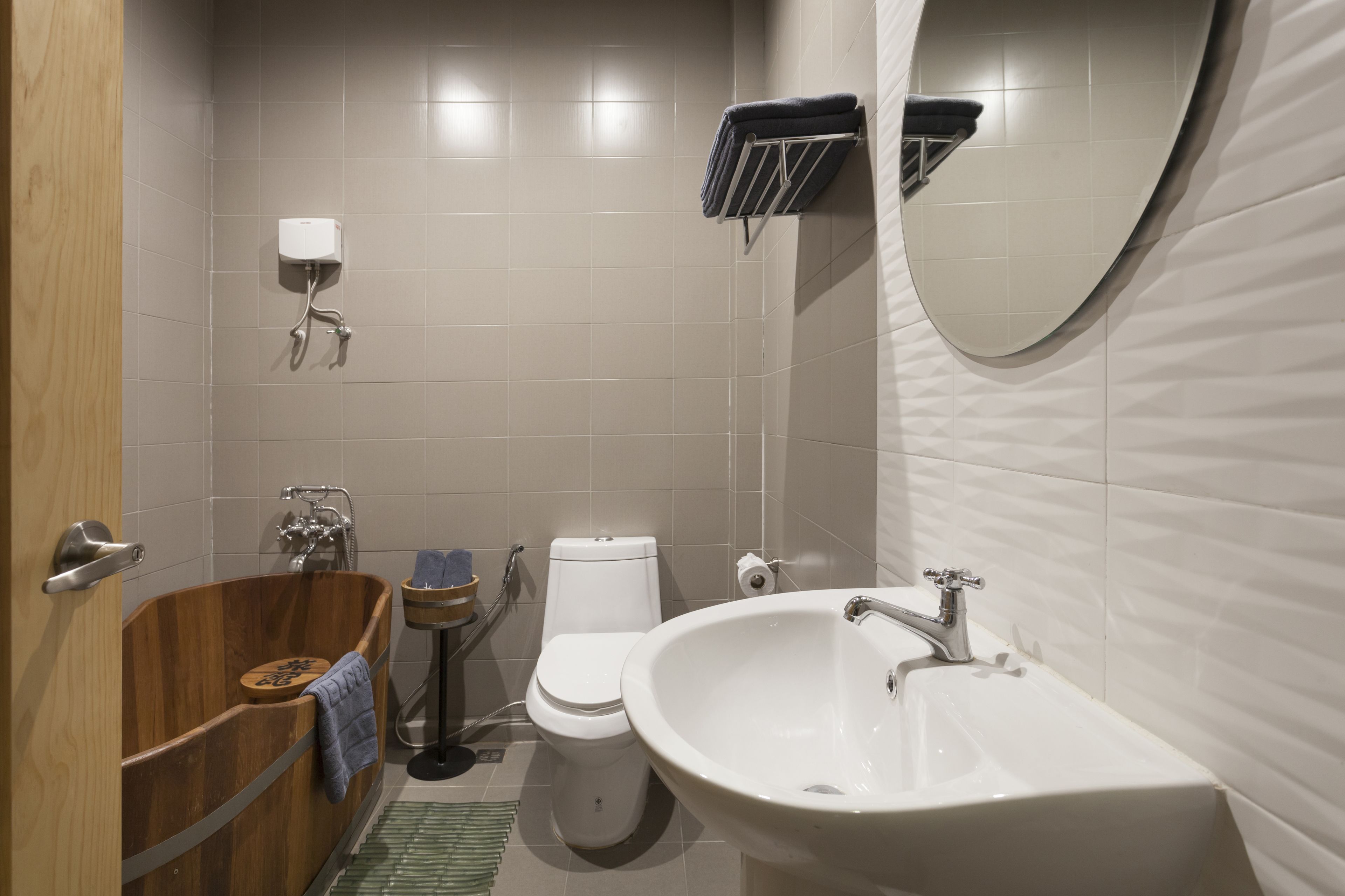 deluxe room | bathroom | designer toiletries, hair dryer, bathrobes, slippers