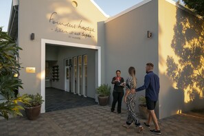 A modern building entrance with a sign reading "Founders Lodge - Where it all began - by Mantis." - Founders Lodge by Mantis (Paterson)