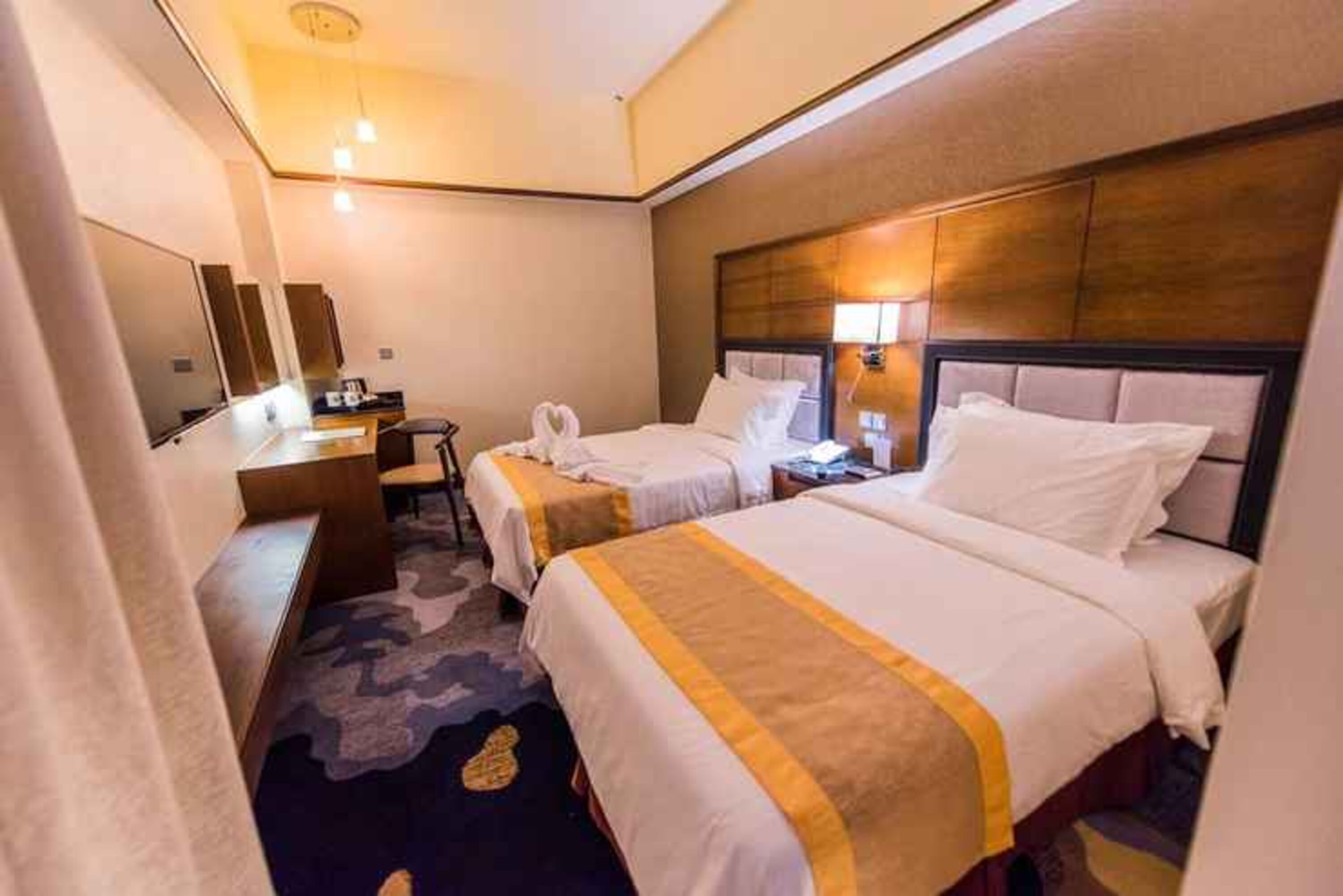 deluxe twin | 1 bedroom, in-room safe, desk, iron/ironing board