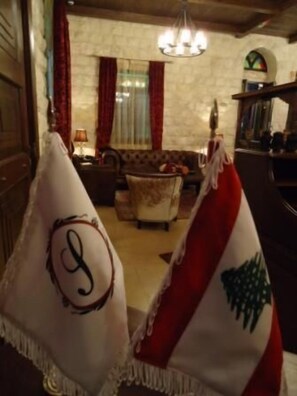 A room with a chandelier, a sofa, and a fireplace. - Siena Hotel (Ghazir)