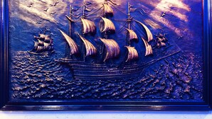 A framed maritime sculpture with ships and waves. - CK Hotel (Malacca City)