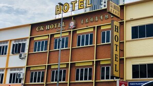 A hotel building with a sign that reads "CK HOTEL" and another sign in a different language. - CK Hotel (Malacca City)