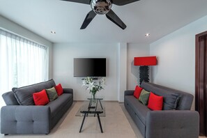 Pool View Villa | Living area | Flat-screen TV, DVD player