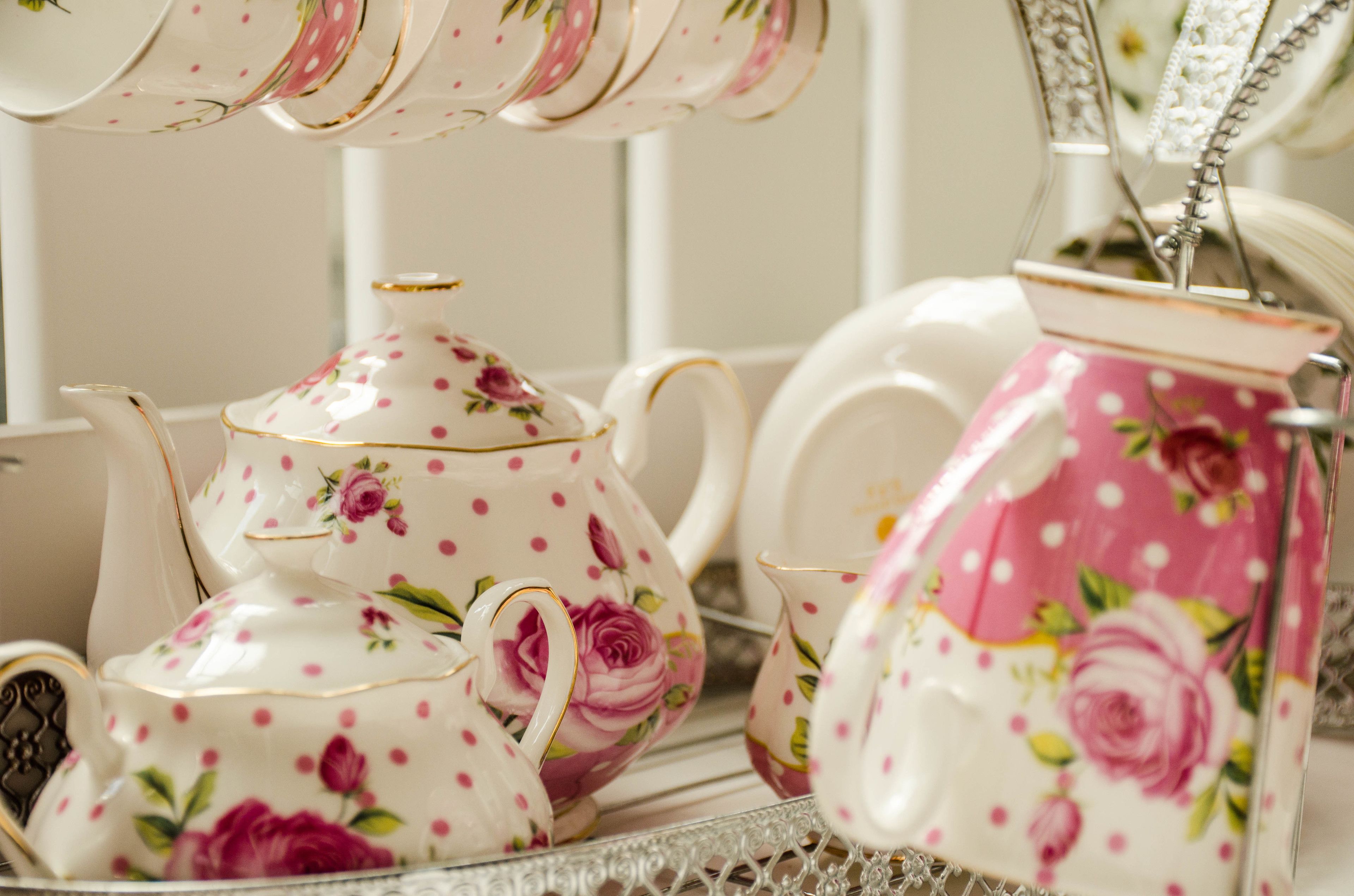 A tea set with floral patterns and a teapot with a lid.