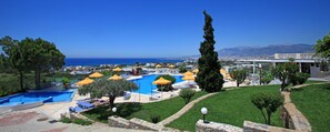 Indoor pool, outdoor pool, pool umbrellas, pool loungers