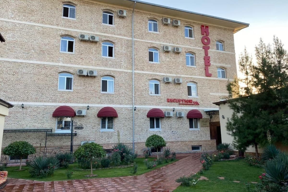 A multi-story hotel with a reception area and a sign indicating a restaurant.
